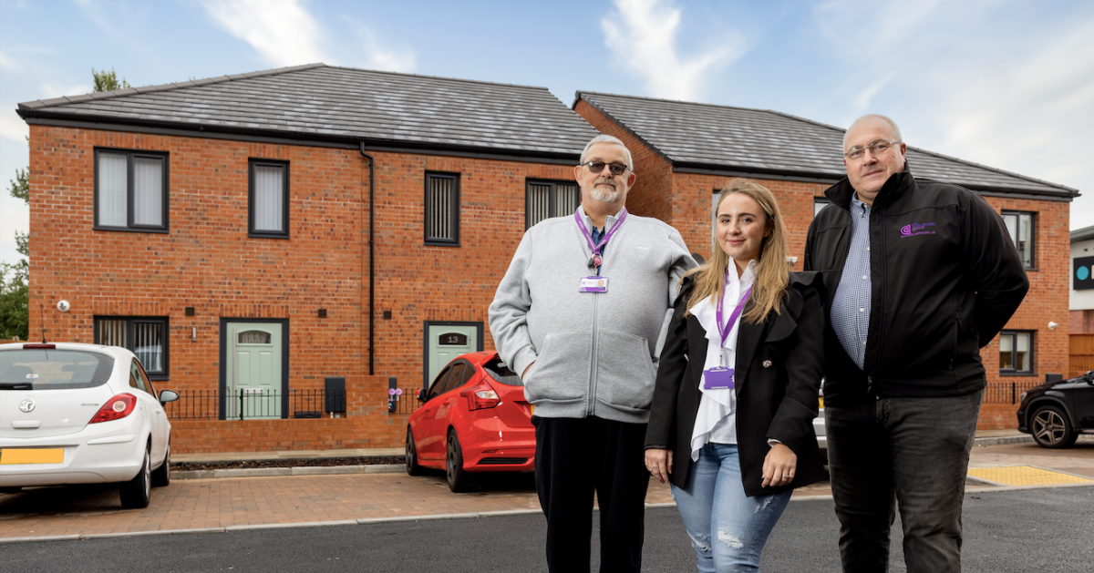Representatives from Halton Housing and Challenger Building Services outside the Okell Street scheme
